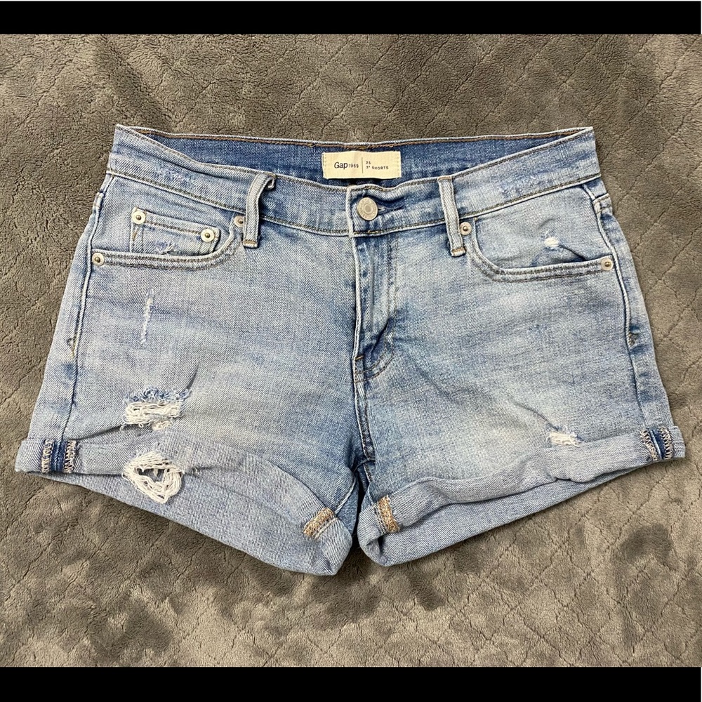 Distressed denim shorts.
